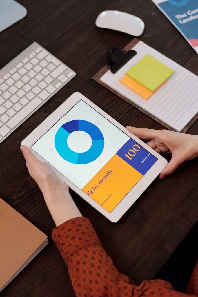 The Art of Drawing Readers In: Your attractive post title goes here Modern office setting featuring a digital tablet displaying a graph, perfect for business presentations.