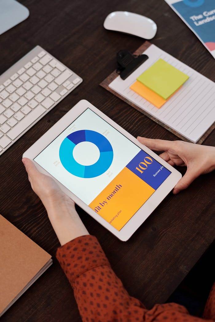 The Art of Drawing Readers In: Your attractive post title goes here Modern office setting featuring a digital tablet displaying a graph, perfect for business presentations.